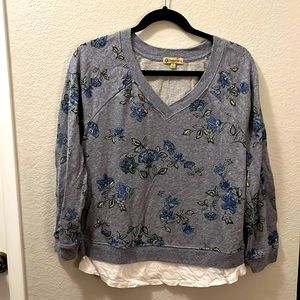 Democracy size medium blue long sleeve shirt with flowers.